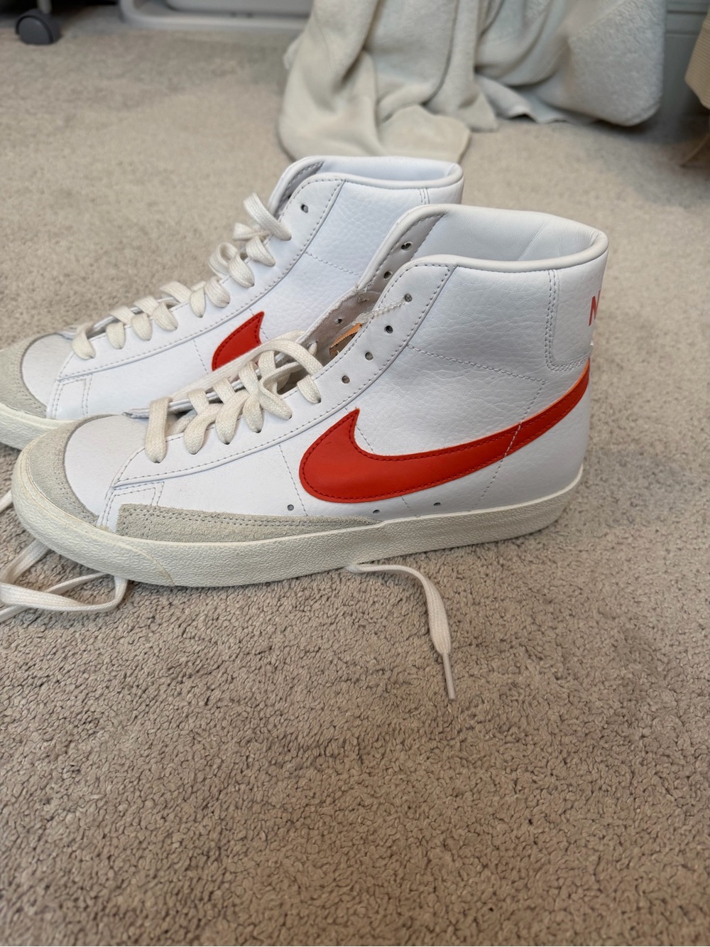 Nike Men’s White High-Top Sneakers with Orange/Red Swoosh